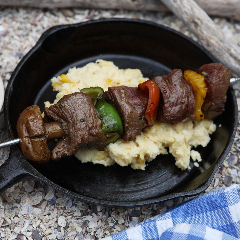 Ostrich Kebabs Served with Peanut Sauce and Mealie Pap